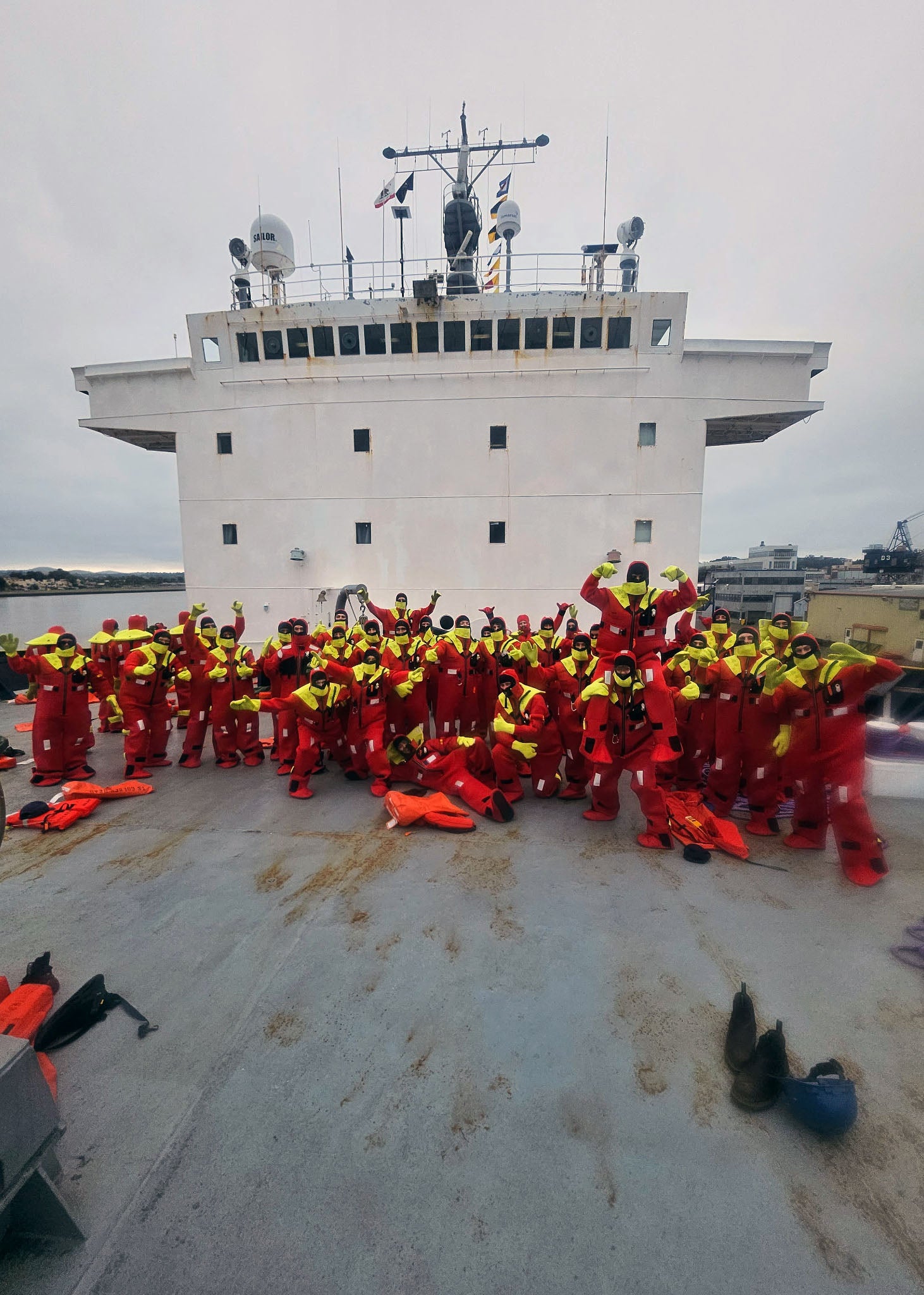 Cadets training in immersion survival suits aboard the Training Ship Golden Bear.