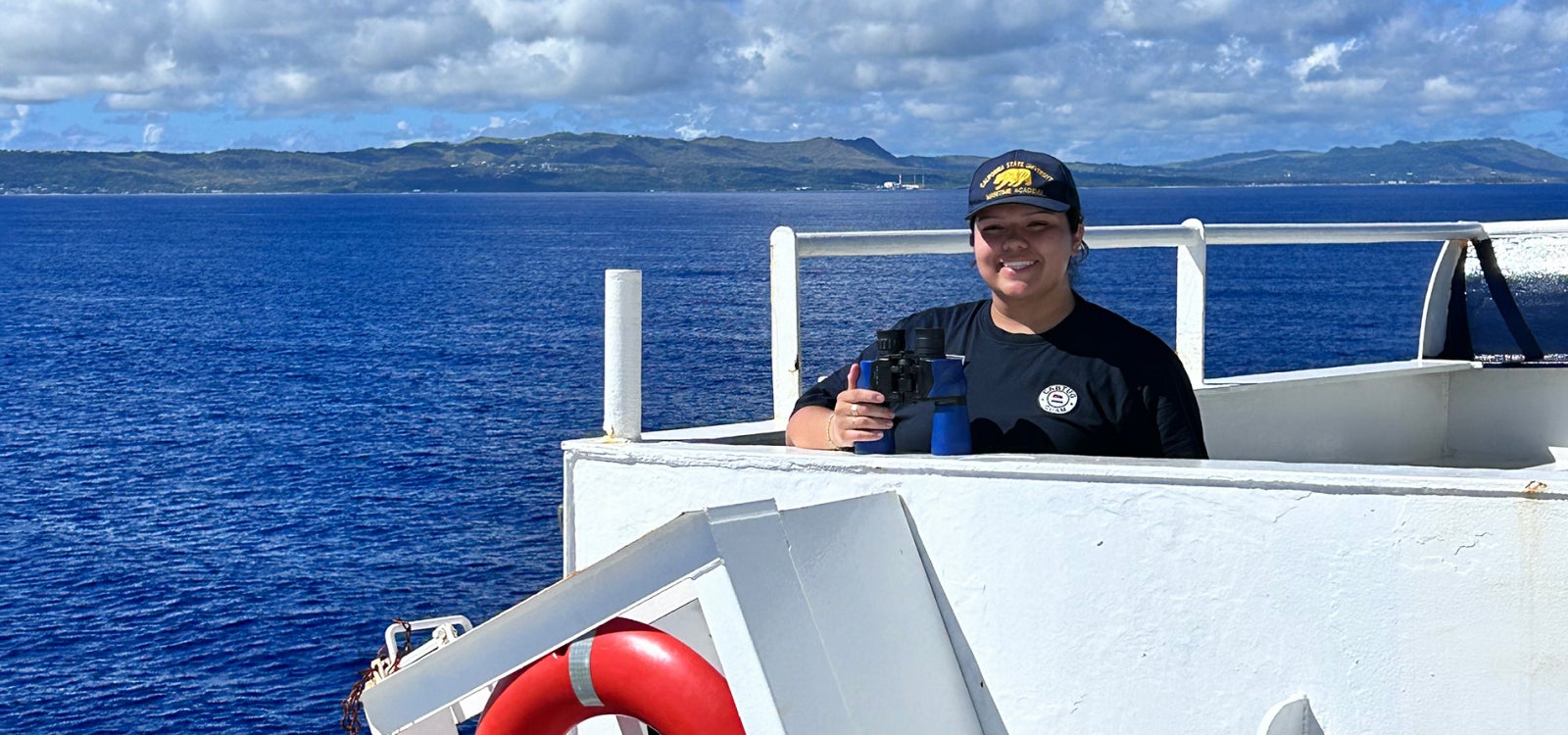 A student on TS Golden Bear as it approaches Guam