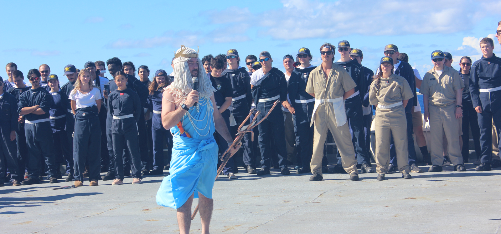 A Cal Poly Maritime Academy leader dressed up as King Neptune addresses cadets aboard Training Ship Golden Bear during the Sinbad Games.