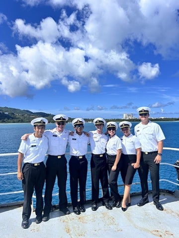 Cadets pose on the deck of Golden Bear in Saipan harbor