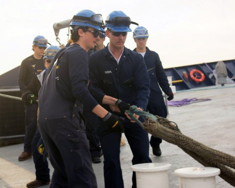 Dietrich Allen practices mooring operations with a first-year cadet during Summer Sea Term. 