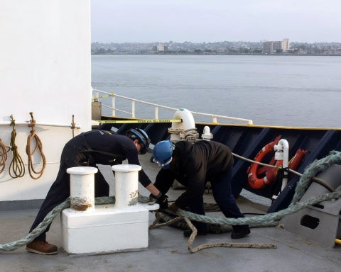 Dietrich Allen practices mooring operations with a first-year cadet during Summer Sea Term.