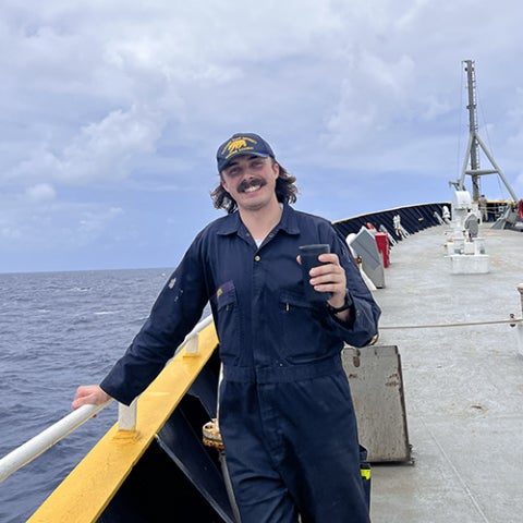 Cadet Parker Loden enjoying a cup of his daily coffee with the view of the ocean.