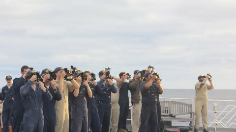 Cadets practice celestial navigation using sextants.