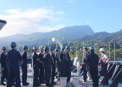 Cadets from Deck Company 4D work with tug pilots during docking operations in Tahiti.