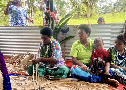 Villagers at Vuisiga Village demonstrate the traditional art of mat weaving, a craft that is primarily practiced by women and remains an important part of village life. 