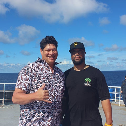 Two Cal Poly Maritime Academy students standing together on the deck of Training Ship Golden Bear.
