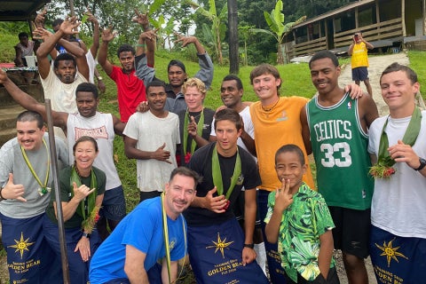Captain and crew with villagers in Tahiti