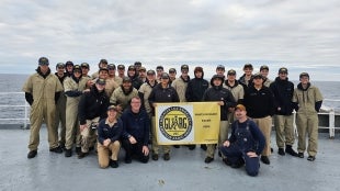 Amateur radio competitor pose on deck 