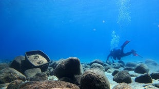 A SCUBA diver exploring the bottom of Lake Tahoe.