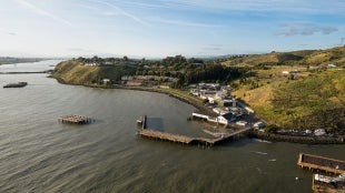 A panoramic drone image of the Cal Poly Maritime Academy campus and bay.