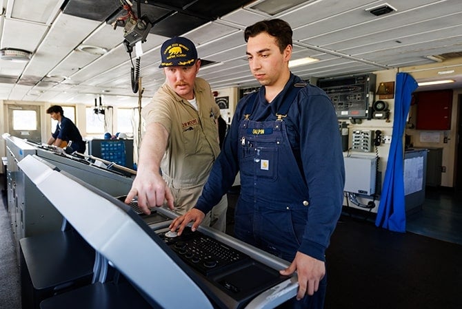 Instructor and student on control panel