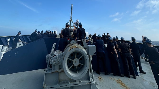 A group of students in uniform at sea