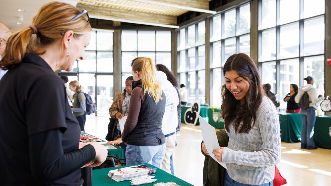 A high school student visits a fair. 